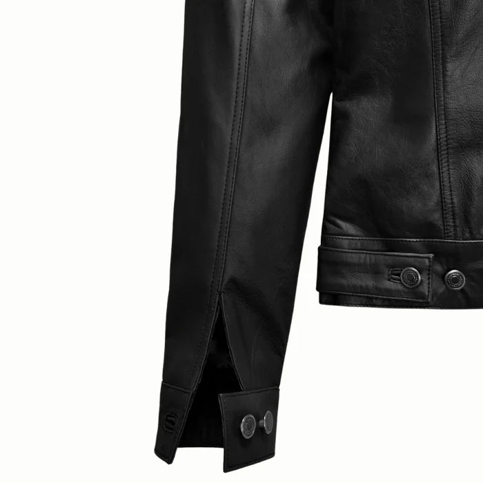 Close-up view of sleeve of black trucker leather jacket