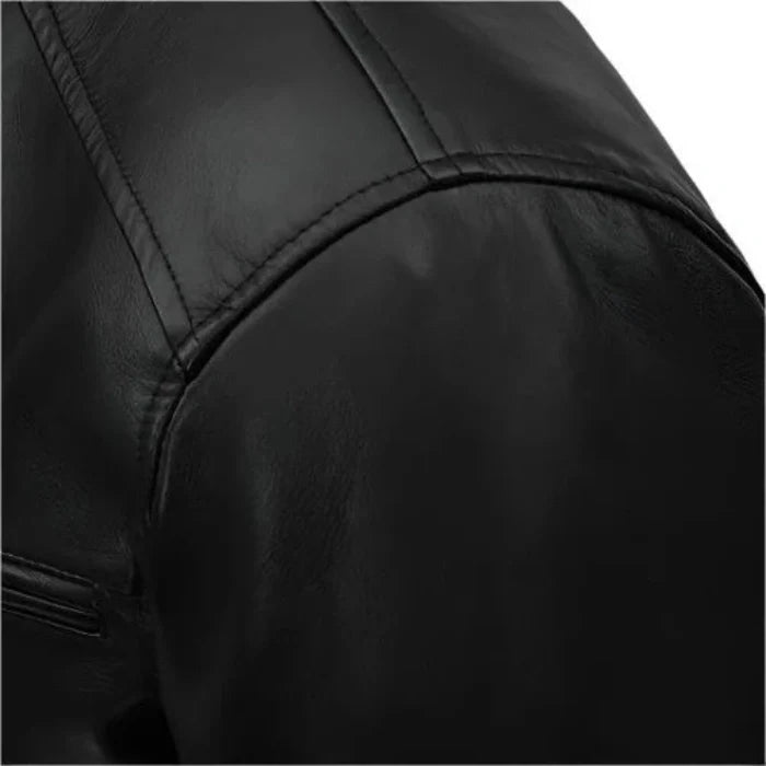 Close-up of a black leather jacket with a focus on texture and stitching.